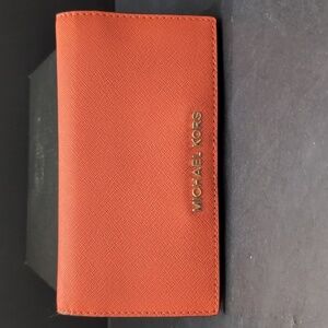 Michael Kors Women's Orange Leather Jet Set Slim Travel Wallet.